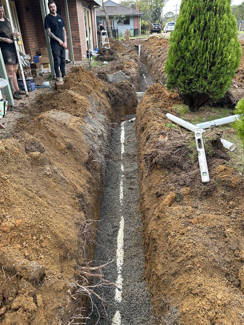 New drainage run laid and bedded in an open trench